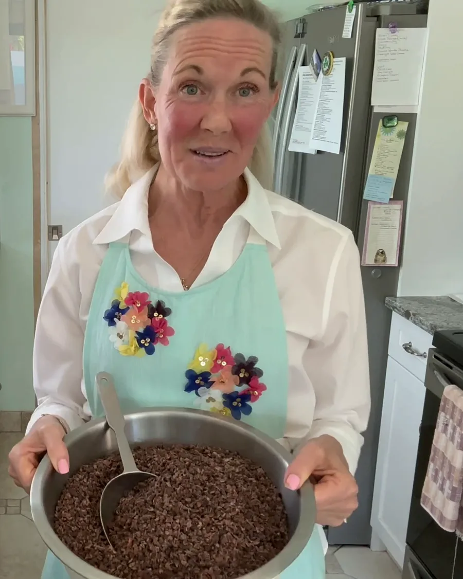 Tracey O’Hara in her kitchen holding a bowl of cacao nibs